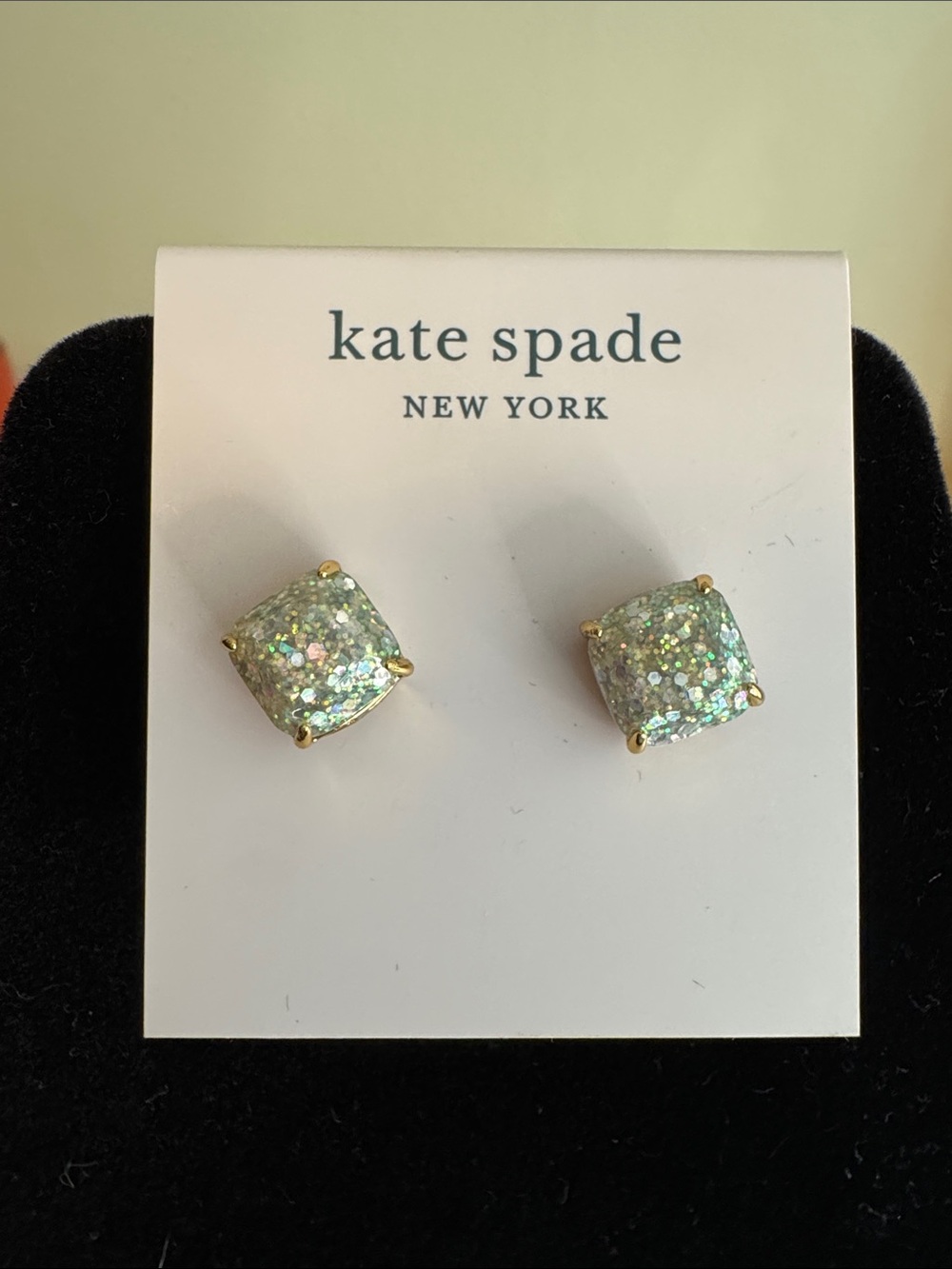 kate spade clear and mint glitter cushion stud earrings with gold-tone prongs